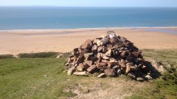 coastal red stone cairn - blog sidebar