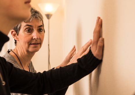 slider - tension and trauma exercises - hand on wall