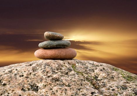 cairn rocks beach sea calm sand sunset